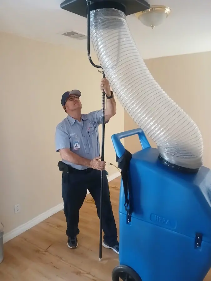 Furnace Tune-Up technician using HEPA equipment in Lincoln Village